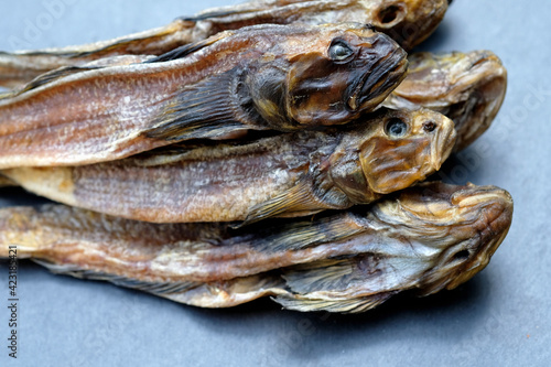 Dried gobies close up. Salted dried fish for beer. Dried salted Gobius top view.