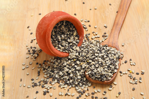 Split Black Lentil Also Know as Black Gram, Black Urad Dal, Vigna Mungo, Urad Bean on wooden background. photo