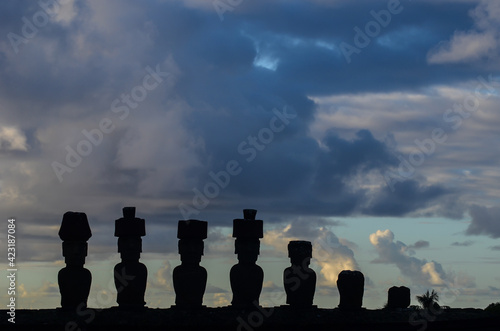 Silhouettes of the Moais from the Ahu Nau Nau, located in a few meters away from the white sands of Anakena beach.Easter Island (Rapa Nui), Isla de Pascua, Region de Valparaiso, Chile.