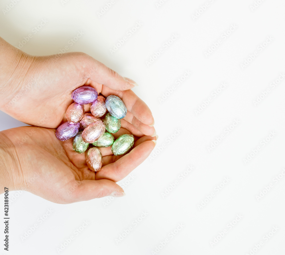 chocolate eggs in female hands chocolate eggs in female hands