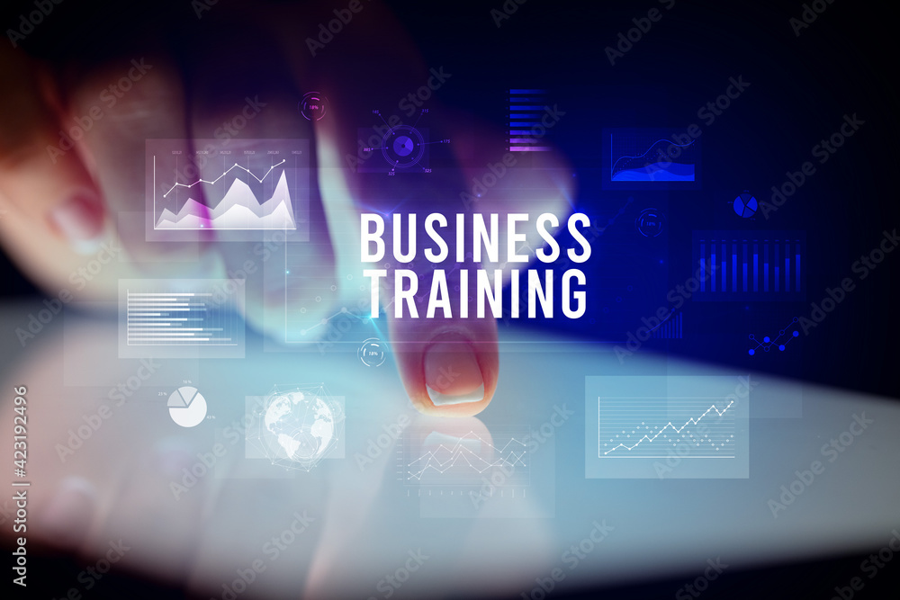 Finger touching tablet with business graphs and icons concept Finger touching tablet with business graphs and icons concept