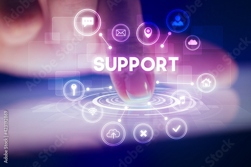 Wallpaper Mural Finger touching tablet with web technology icons concept Torontodigital.ca