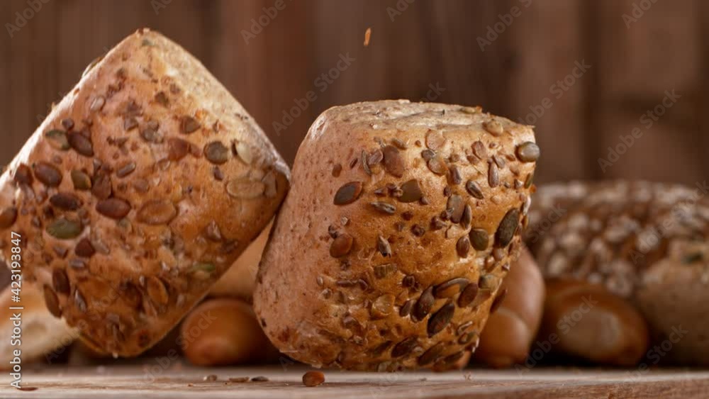 Super slow motion of falling sliced freshly baked bread. Super slow motion of falling sliced freshly baked bread.