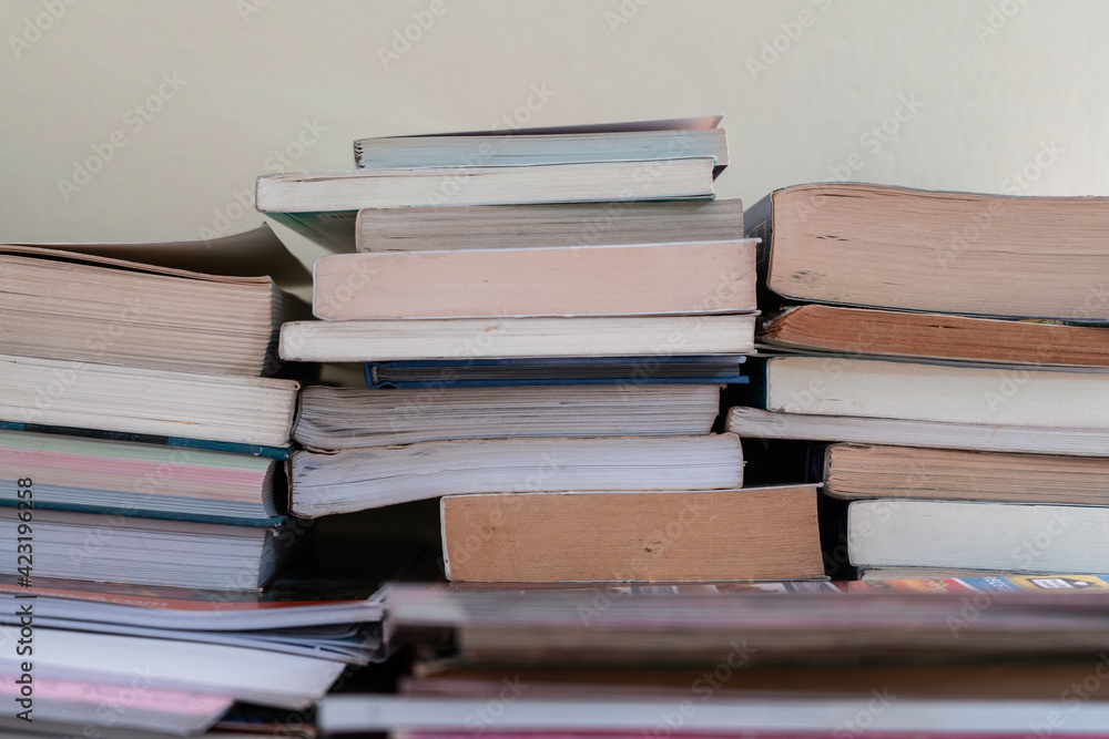 Books stacked on top of each other. Concept of literature and learning. Books stacked on top of each other. Concept of literature and learning.