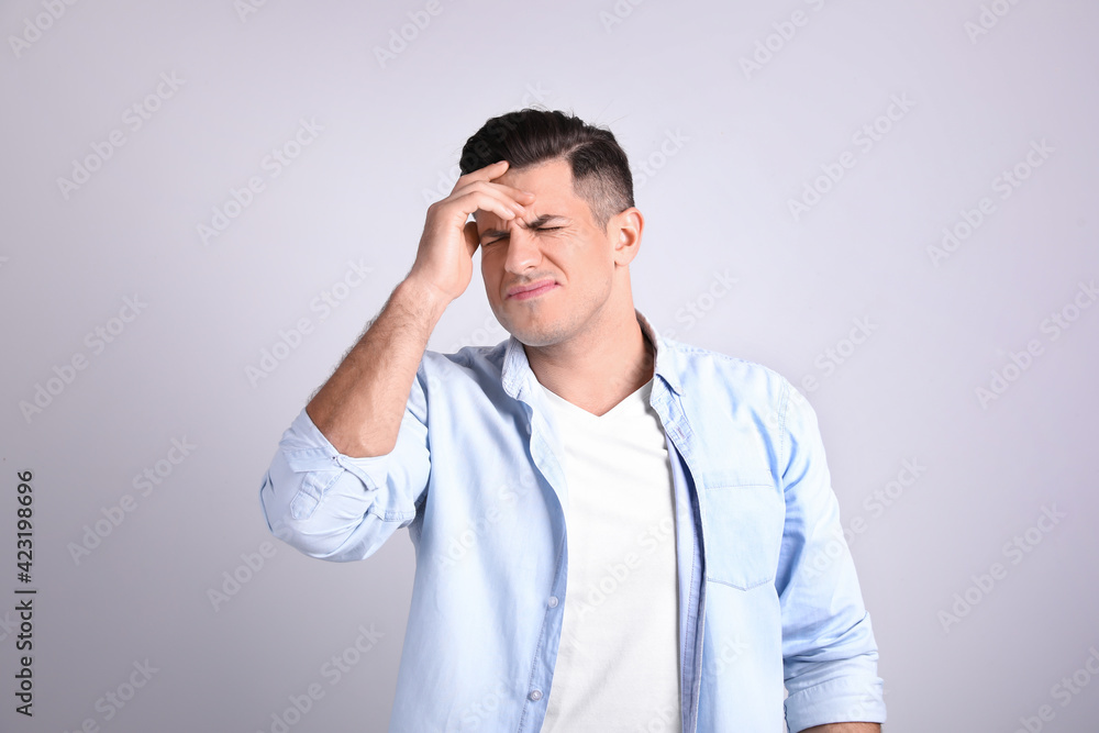 Portrait of stressed man on light background Portrait of stressed man on light background