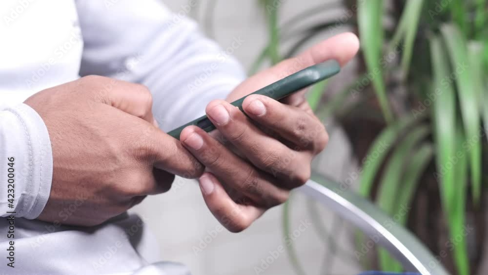 Close up of young man hand using smart phone. Close up of young man hand using smart phone.