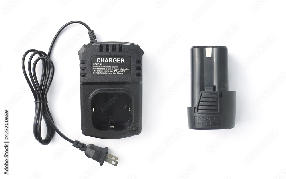 Charger for cordless drill with spare battery Isolated on white background Charger for cordless drill with spare battery Isolated on white background