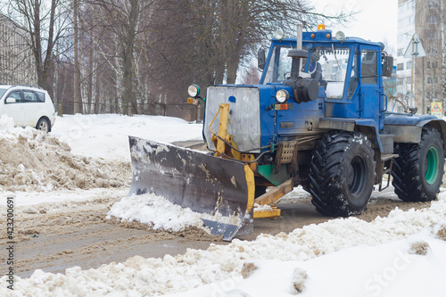 Snow removal from the streets with the help of special equipment in winter