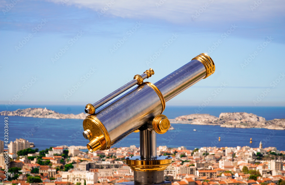 telescope with a sea landscape in background telescope with a sea landscape in background