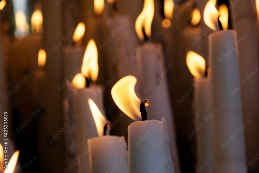 detail of the burning candles next to the basilica of Lourdes, close-up of the candle offerings detail of the burning candles next to the basilica of Lourdes, close-up of the candle offerings
