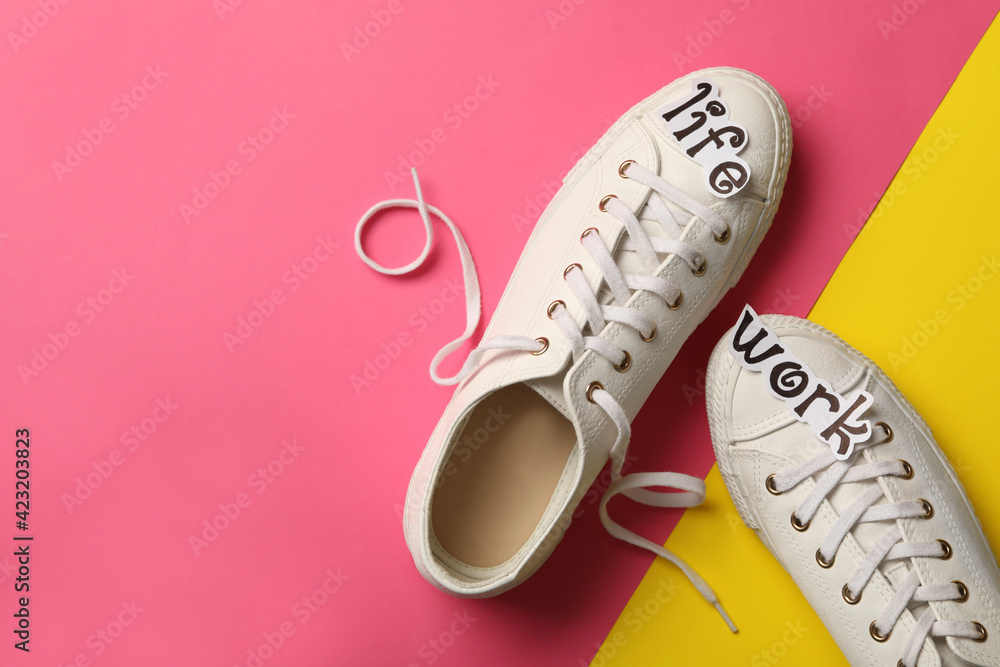Stylish shoes on color background, flat lay with space for text. Life work balance concept Stylish shoes on color background, flat lay with space for text. Life work balance concept