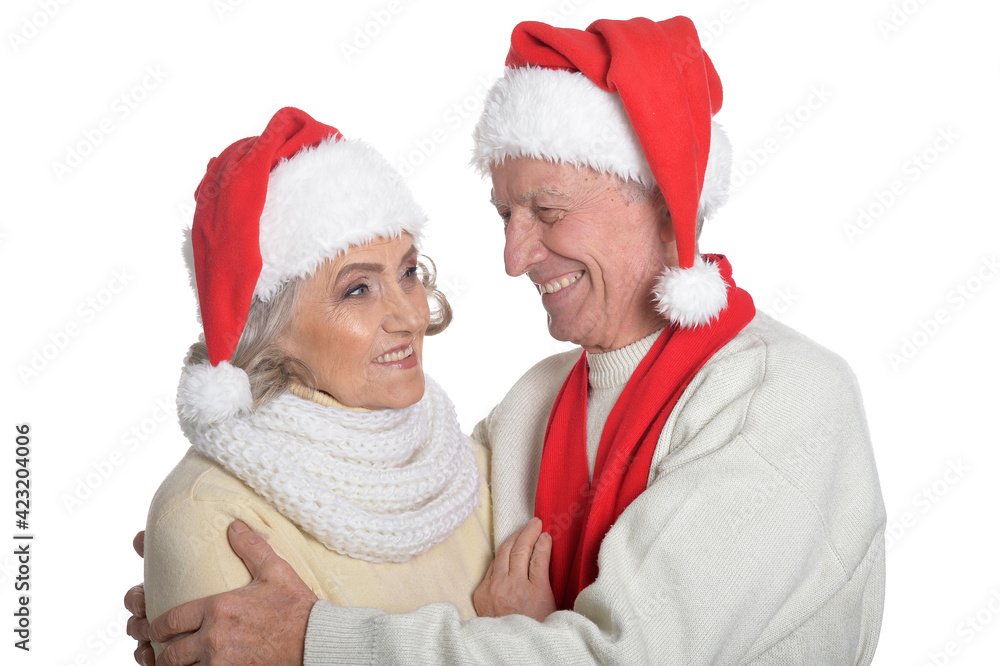 Portrait of happy senior couple in Santa hats Portrait of happy senior couple in Santa hats