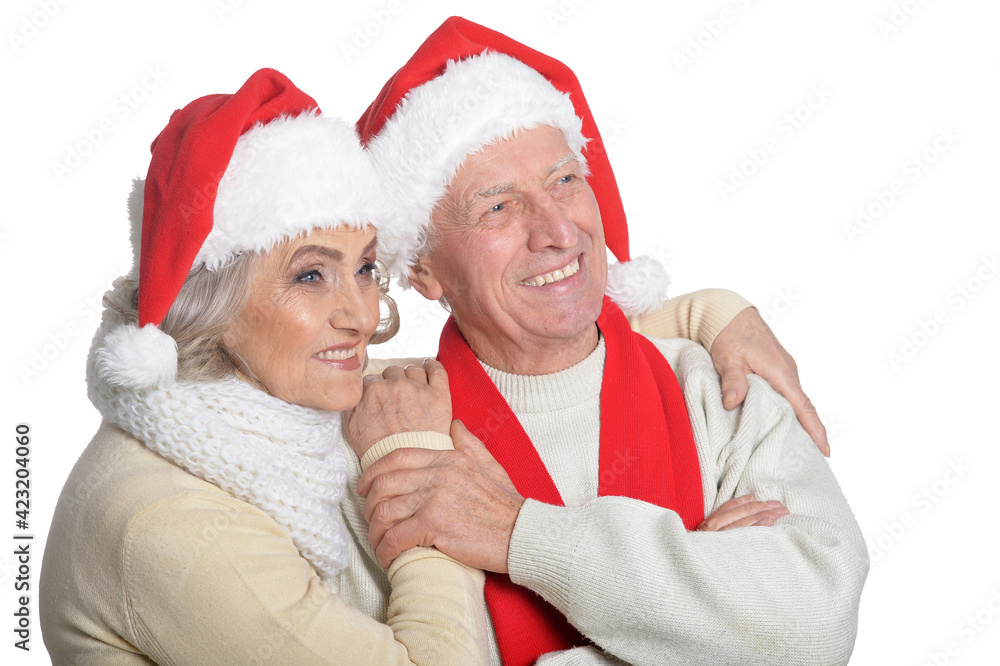 Portrait of happy senior couple in Santa hats Portrait of happy senior couple in Santa hats