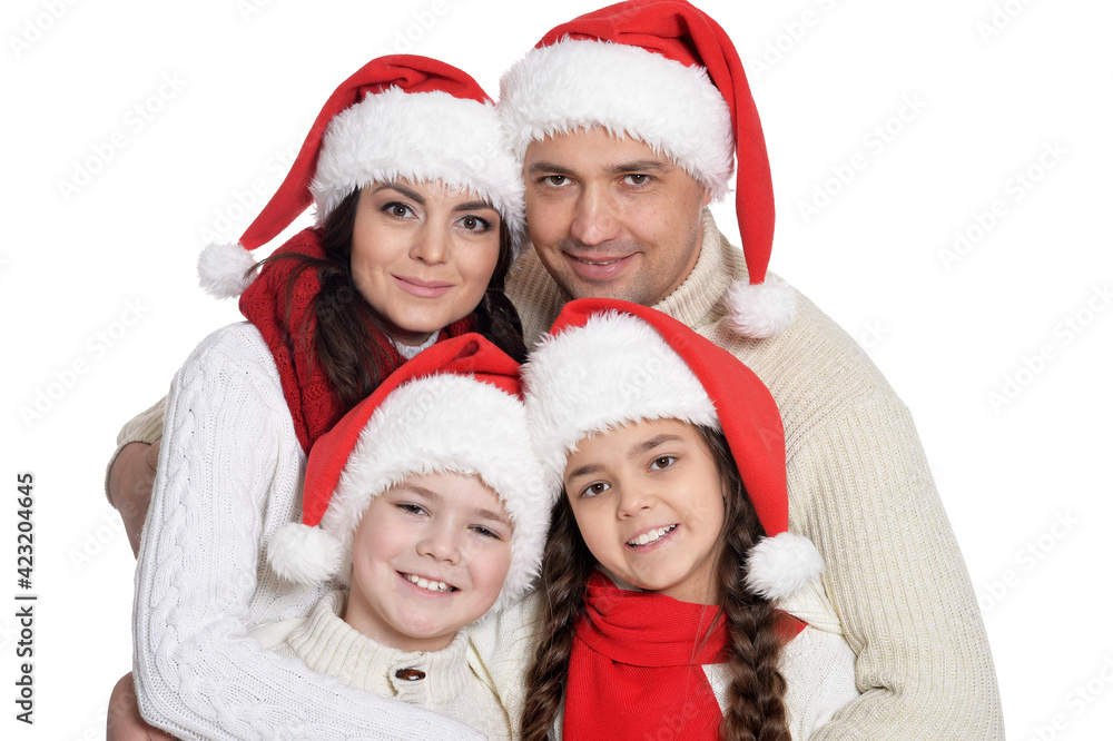 happy family with kids posing in santa hats happy family with kids posing in santa hats