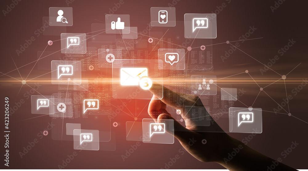 Hand pressing social media multimedia application screen with media icons on futuristic concept Hand pressing social media multimedia application screen with media icons on futuristic concept