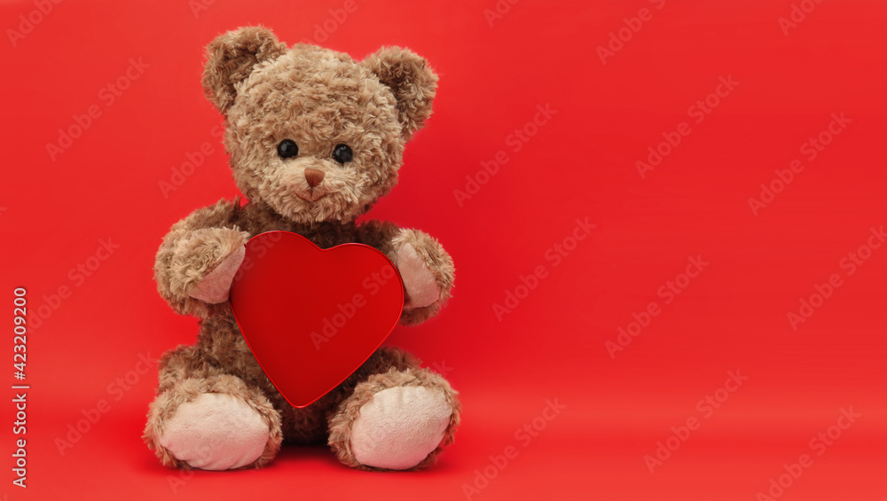 gift card, teddy bear with heart isolated on red background gift card, teddy bear with heart isolated on red background