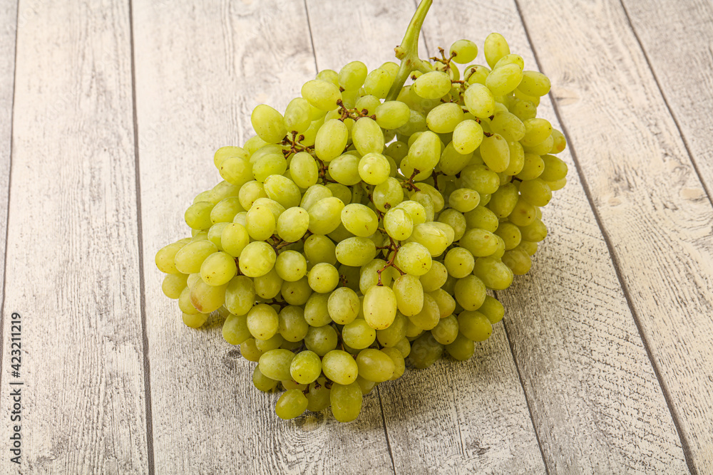 Green grape branch over background Green grape branch over background