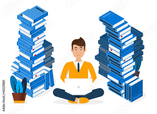 Young man sitting with a computer between books