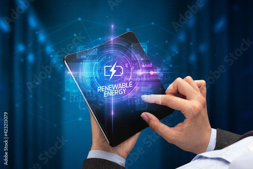 Businessman holding a foldable smartphone, technology concept