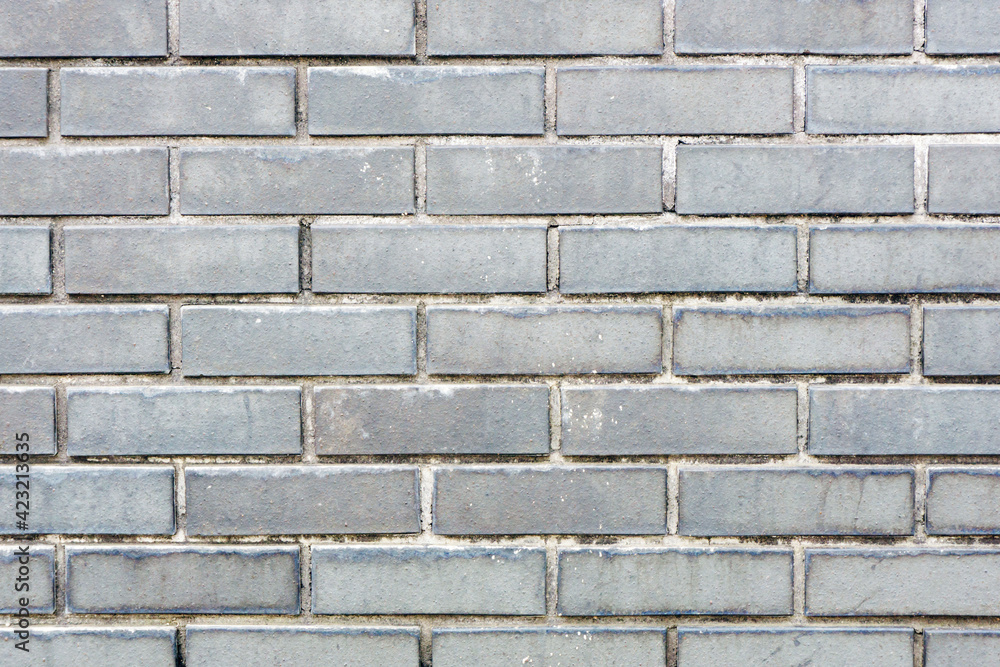 Gray brick wall background. Outdoor house facade texture. Dirty grunge brick wall. Gray vintage block structure. Old architecture background. Vintage weathered pattern. Gray brick wall background. Outdoor house facade texture. Dirty grunge brick wall. Gray vintage block structure. Old architecture background. Vintage weathered pattern.