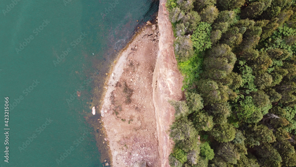 View from the sky of a rocky beach of an island
