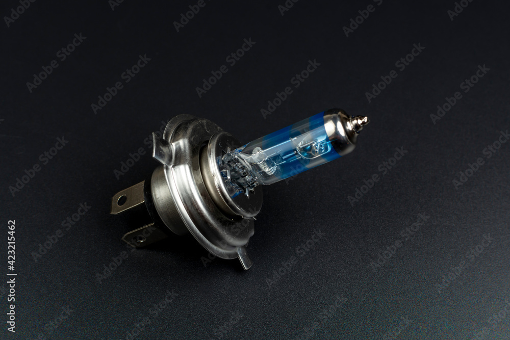blue car head light bulb on black background blue car head light bulb on black background