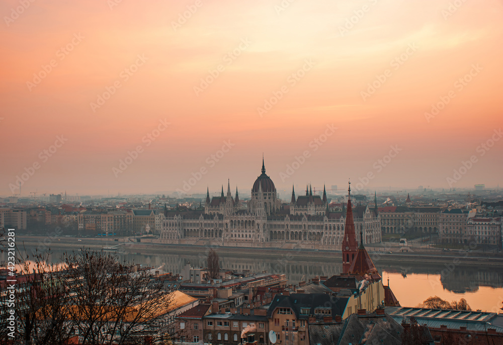Morning Budapest, Parliament against the backdrop of a dramatic sky reflected in the water