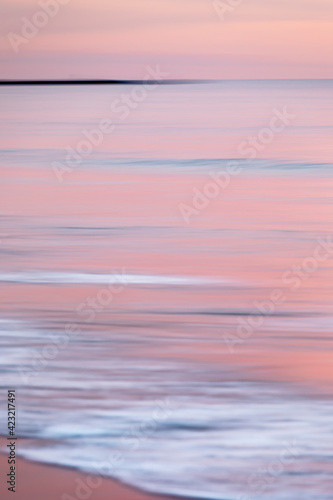 abstract landscape of sea. texture water, sky and sand in blurry motion in tropical sunset colors © Francesca