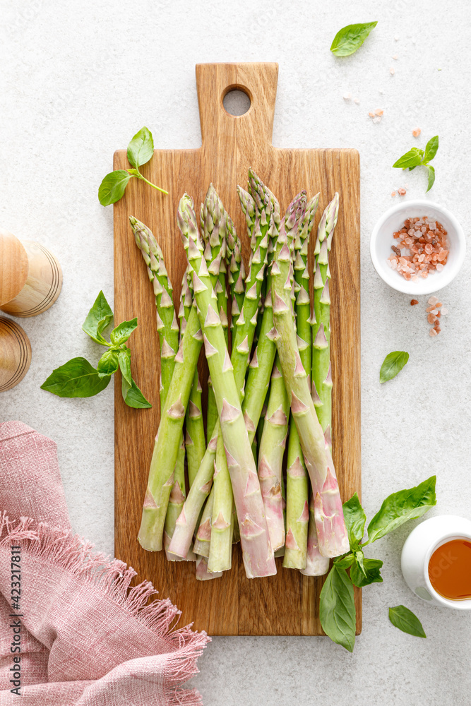 Asparagus. Cooking bunch of asparagus on kitchen table. Top view Asparagus. Cooking bunch of asparagus on kitchen table. Top view