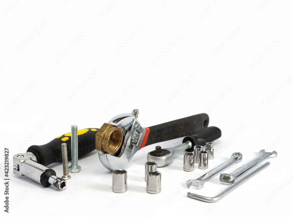 Repair tools and various parts on a white background Repair tools and various parts on a white background
