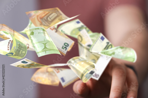 Quadro su tela euro bills flying around  in hand