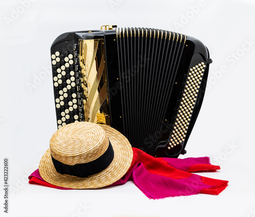 Accordion and straw hat going to celebrate photo