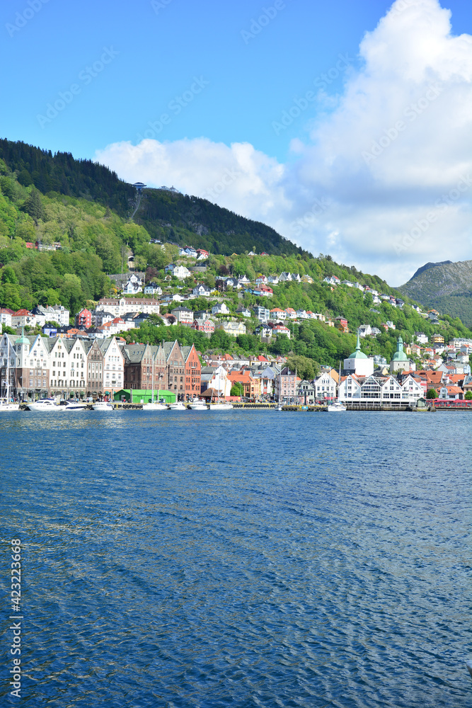 View of Bryggen old town and Ulriken mountain from Bergen in Norway with harbor and sea