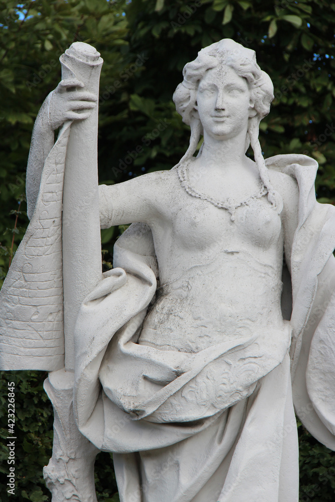 statue of a muse (?) in the gardens of the belvedere palace in vienna (austria)  - obrazy, fototapety, plakaty 