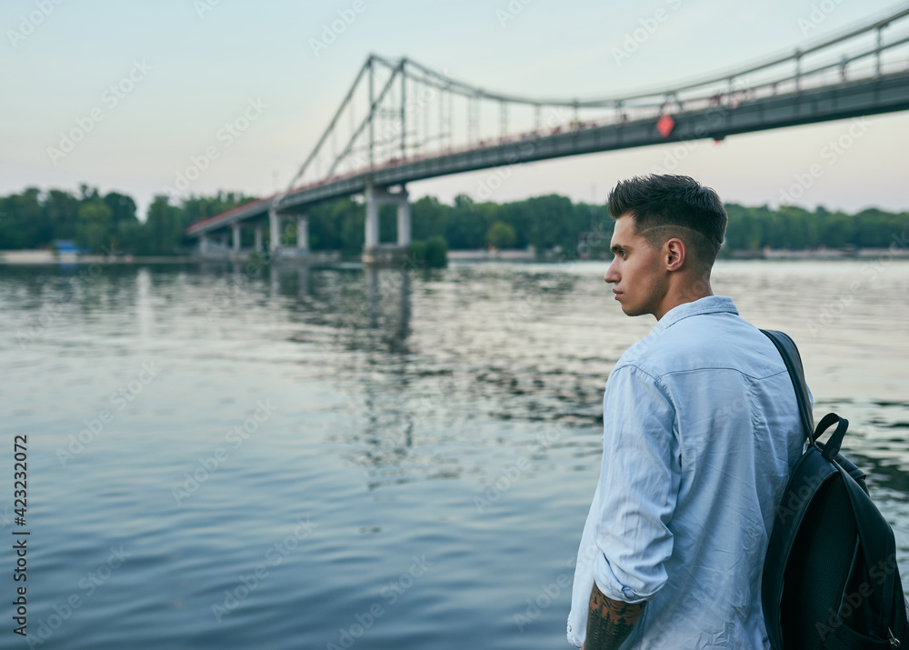 Young european man standing on a city street Young european man standing on a city street