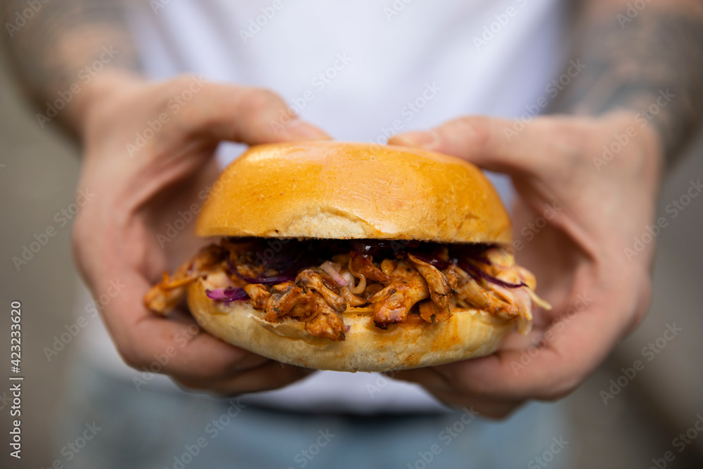 person holding a sandwich person holding a sandwich