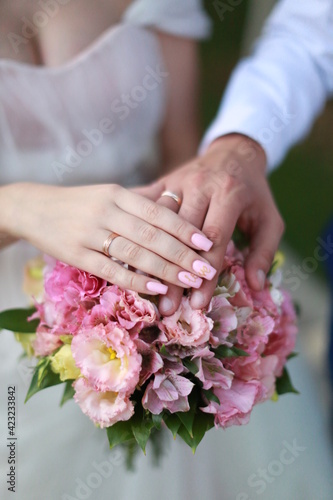 bride and groom holding hands