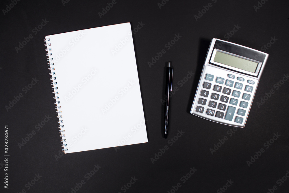 notebook on black desktop, taxes notebook on black desktop, taxes