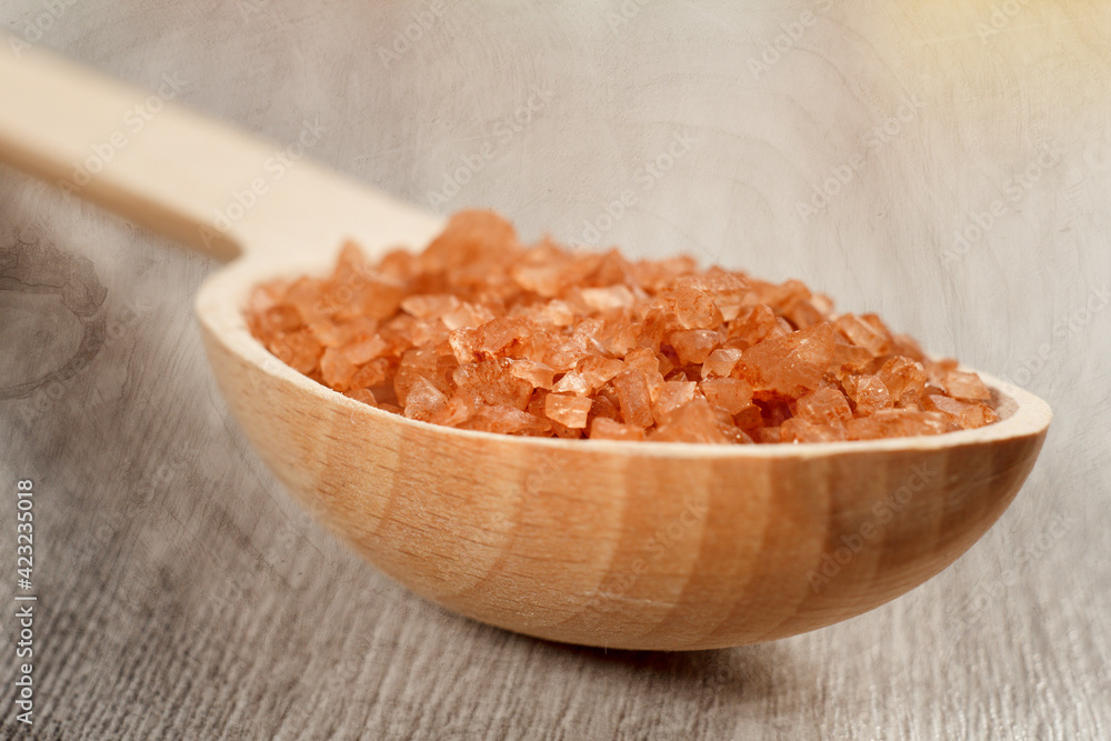 Spa nature products. Wooden spoon with brown sea salt Spa nature products. Wooden spoon with brown sea salt