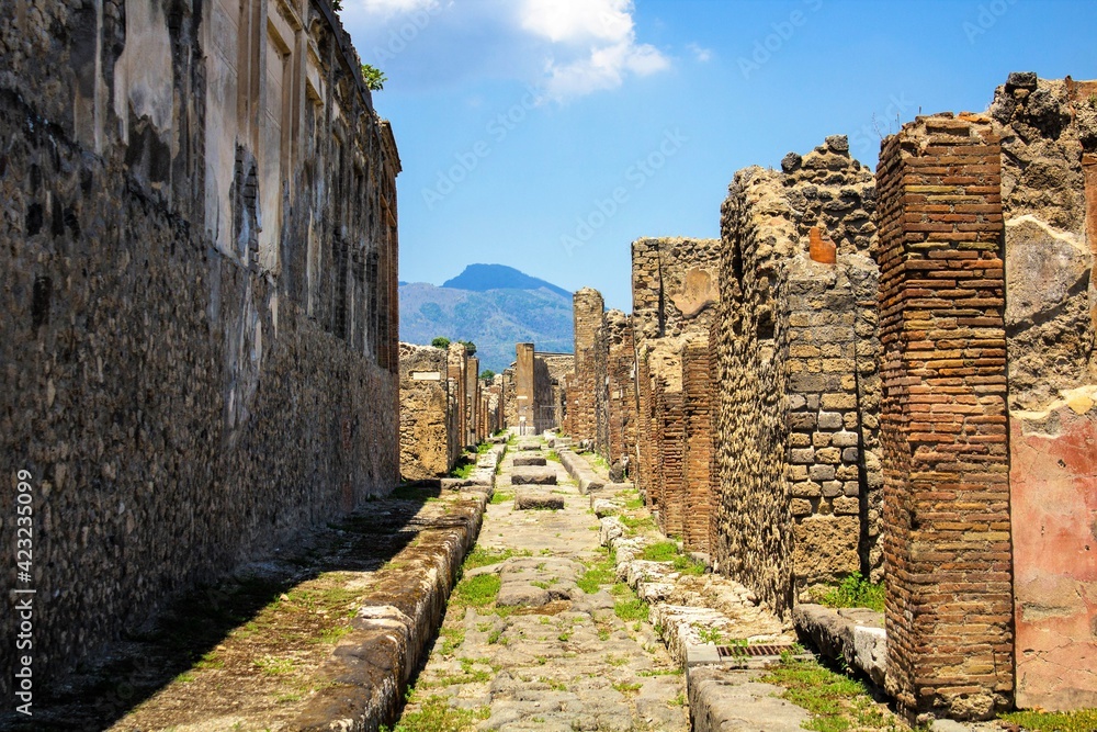 Pompeii, Italy, June 26, 2020 one of the main streets of the Roman city found after excavations 
following the eruption of the volcano Vesuvius in 79 AD.