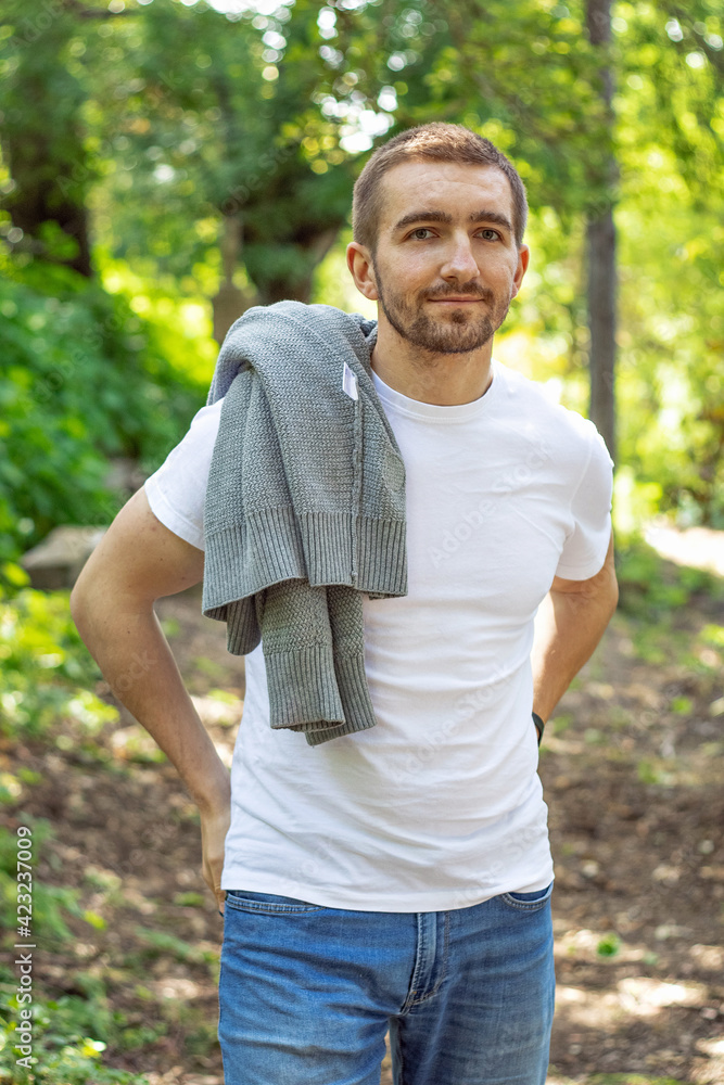 a guy looking thoughtfully into the valley. walks in the park a guy looking thoughtfully into the valley. walks in the park