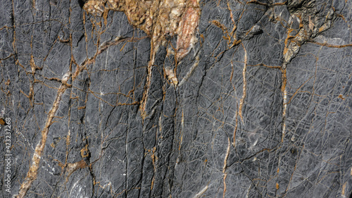 Dark background texture of natural stone © Darcraft