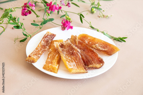 dried dog meat is on a plate