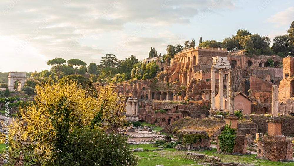 Rome. The  forum romanum at sunrise with view towards the Palatine hill and the Arch of Titus.