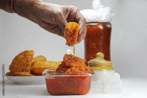 Chunda or Chhundo is sweet nad sour popular Indian Picklemade from grated raw mango,sugar or jaggery and chilly powder and served with thepla or puri in the state of gujarart. photo