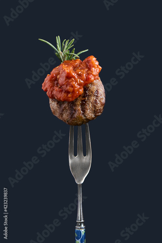 Meatball traditional kofte on fork with aivar. Spicy meatballs Kebab or Kebap Healthy eating concept. Copy space
