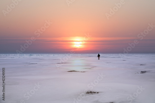 Stunning sunset on Lake Baikal with a lone figure