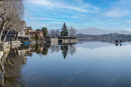 The town of Pusiano is reflected in the water of its lake © Alessio
