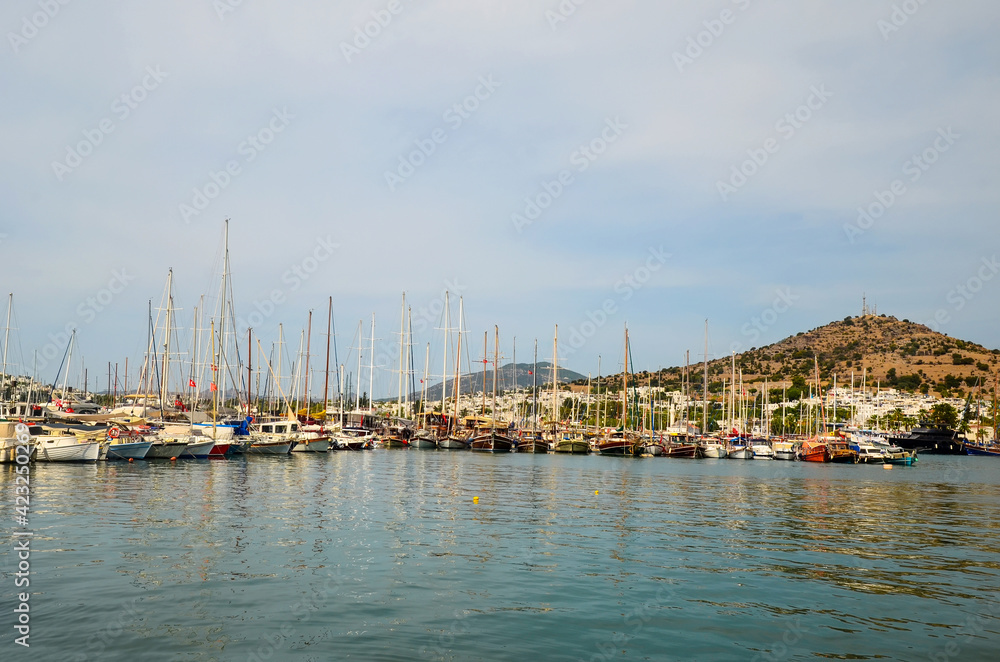 Yachts anchored at Akyarlar marina in Turgutreis, Bodrum, Turkey.Bodrum Peninsula is one of the most summer destinations of Turkey located between the Aegean and Mediterranean Seas.