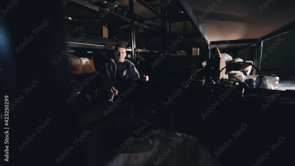 Auto mechanic at the auto parts warehouse. Auto mechanic at the auto parts warehouse.